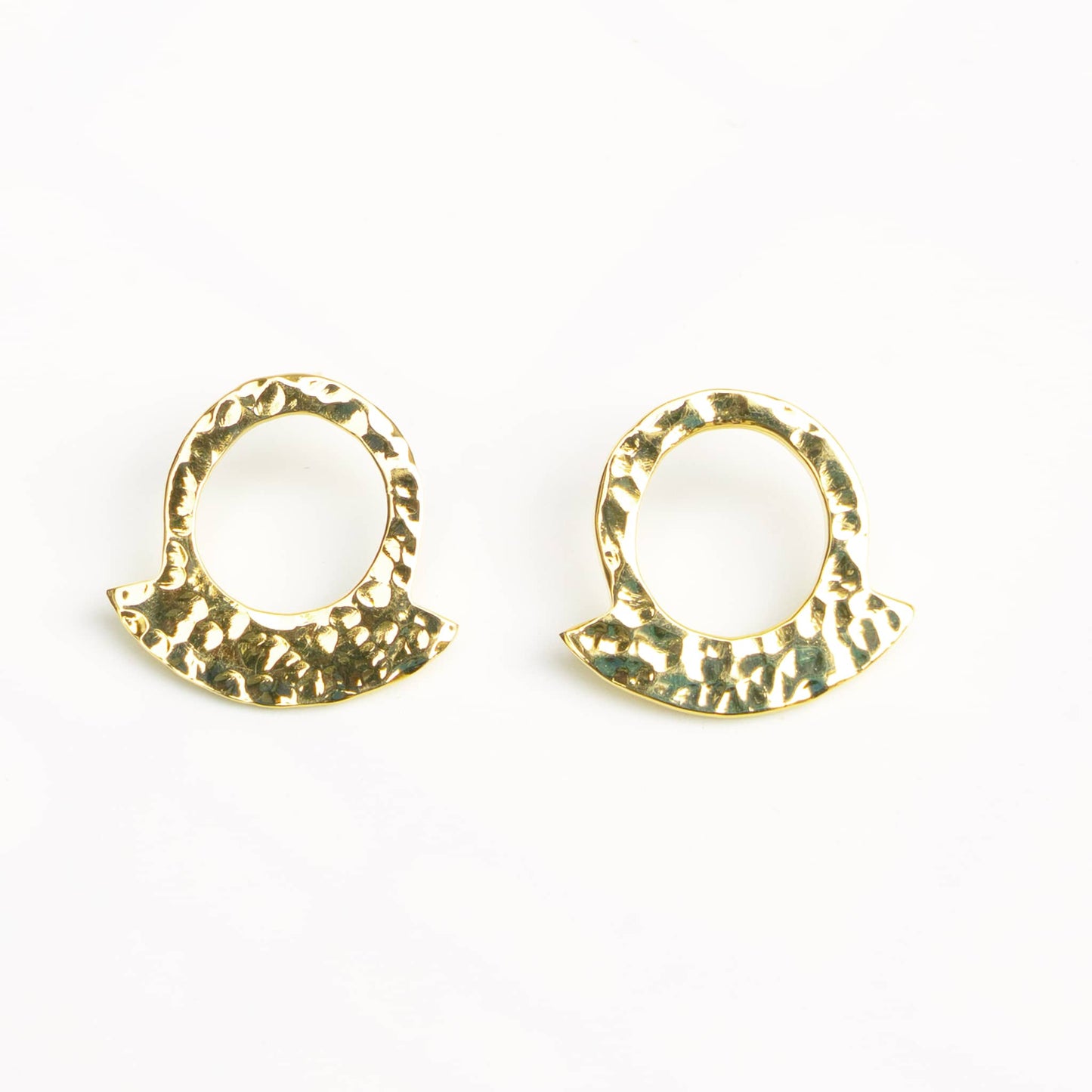 Leo hammered crescent hoop earrings worn showing arc shape