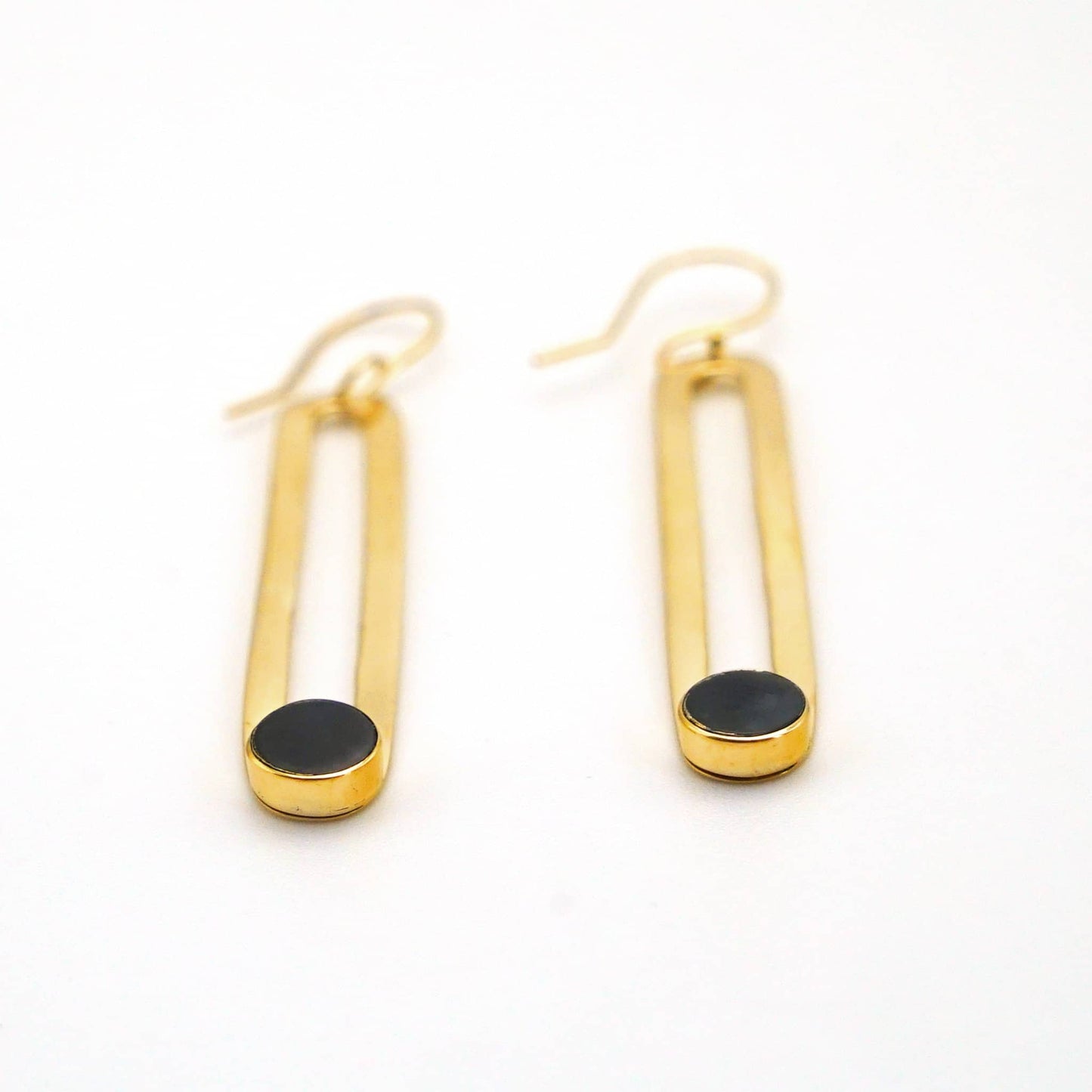 Lila brass and black horn drop hoop earrings flat lay — Ecodunia