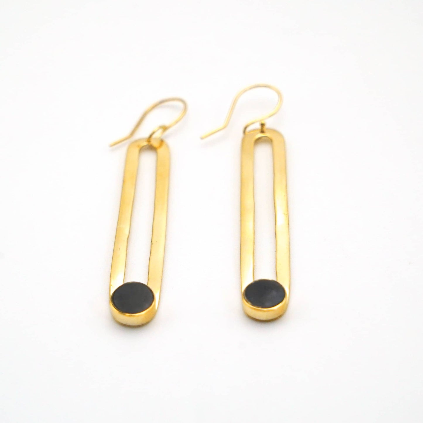 Lila brass horn hoop earrings worn showing drop detail