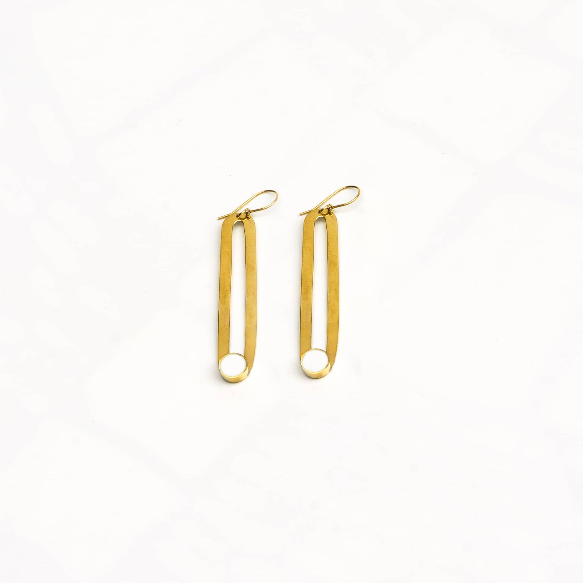 Lila brass and white horn drop hoop earrings flat lay — Ecodunia