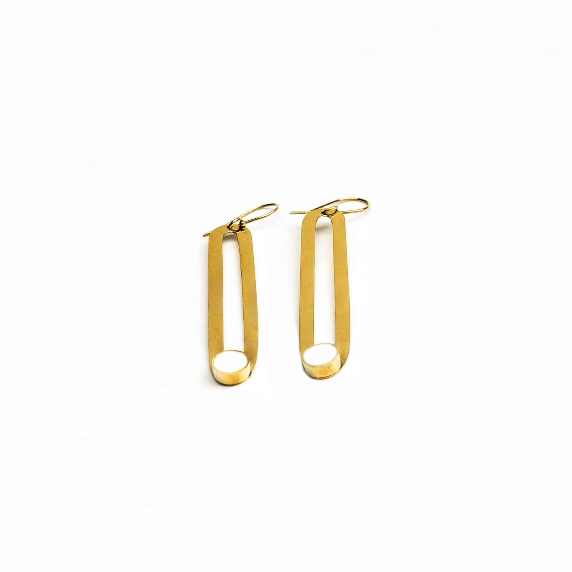 Lila white horn brass hoop earrings worn showing contrast