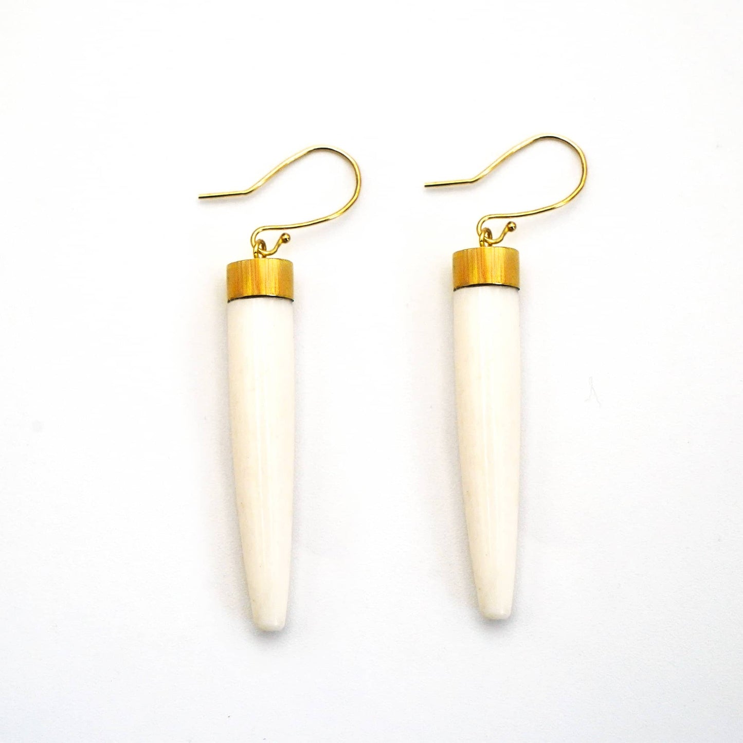 Liwa brass and white bone spike drop earrings flat lay — Ecodunia
