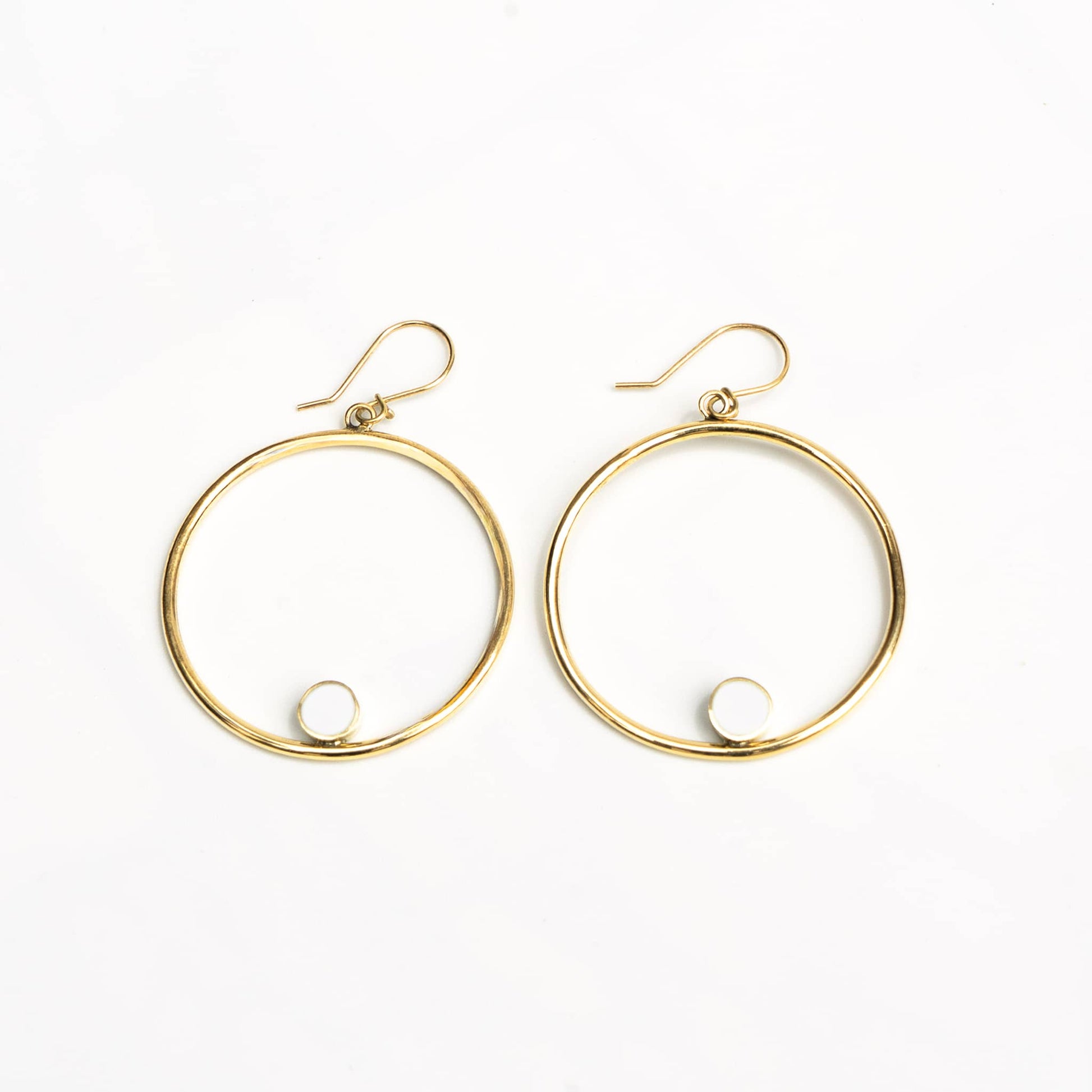 Lozi white horn brass hoop earrings showing accent contrast