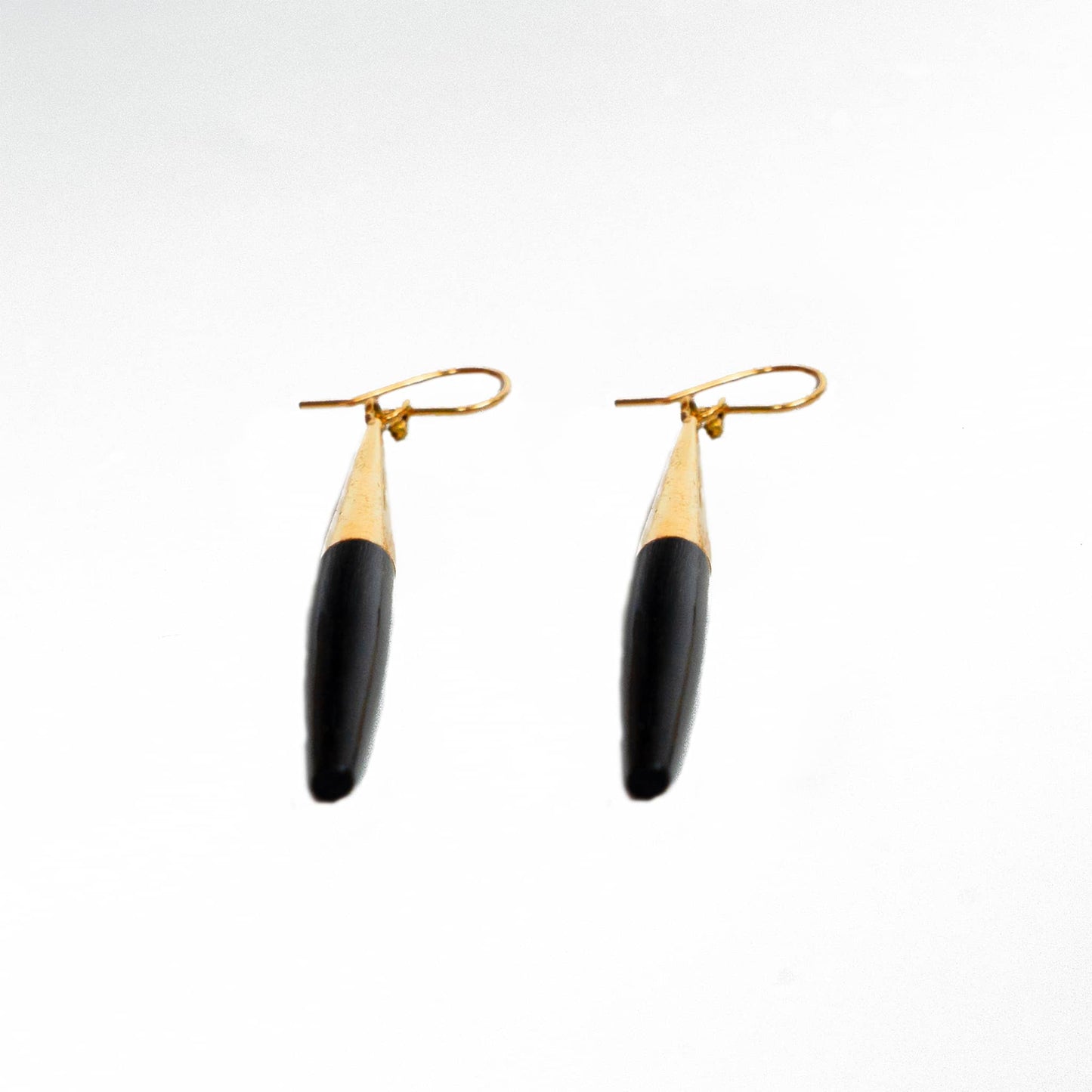 Luna white horn spike earrings worn showing tapered form