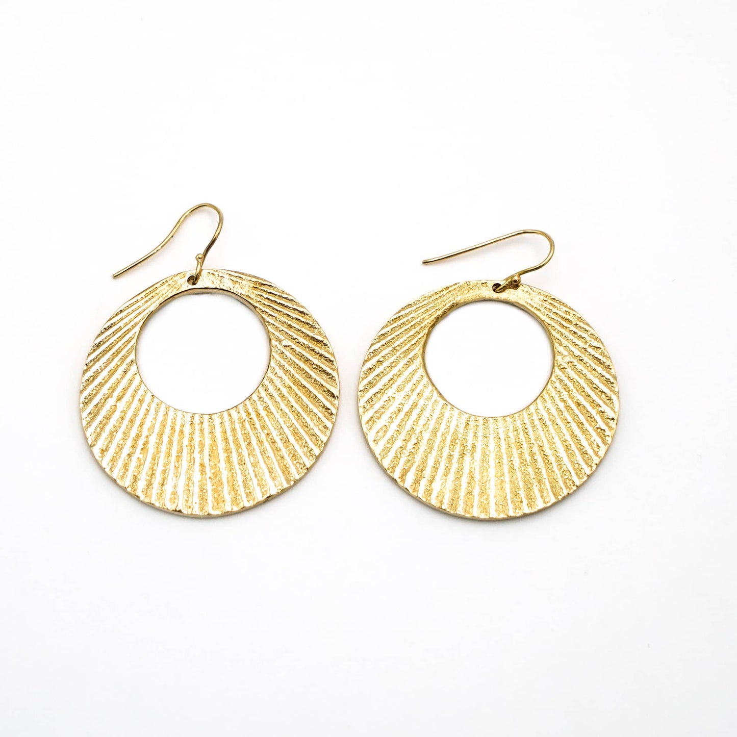 Mali engraved circle disc brass hoop earrings flat lay — Ecodunia