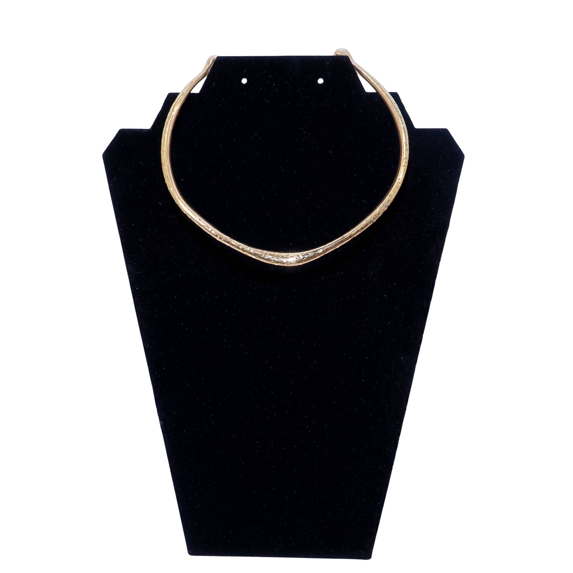Msala wide neck cuff brass choker necklace on brass surface flat lay — Ecodunia
