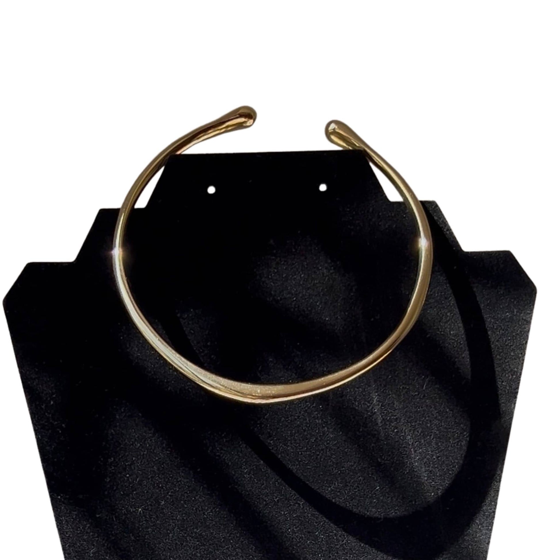 Close-up of Msala brass choker necklace showing smooth neck cuff surface