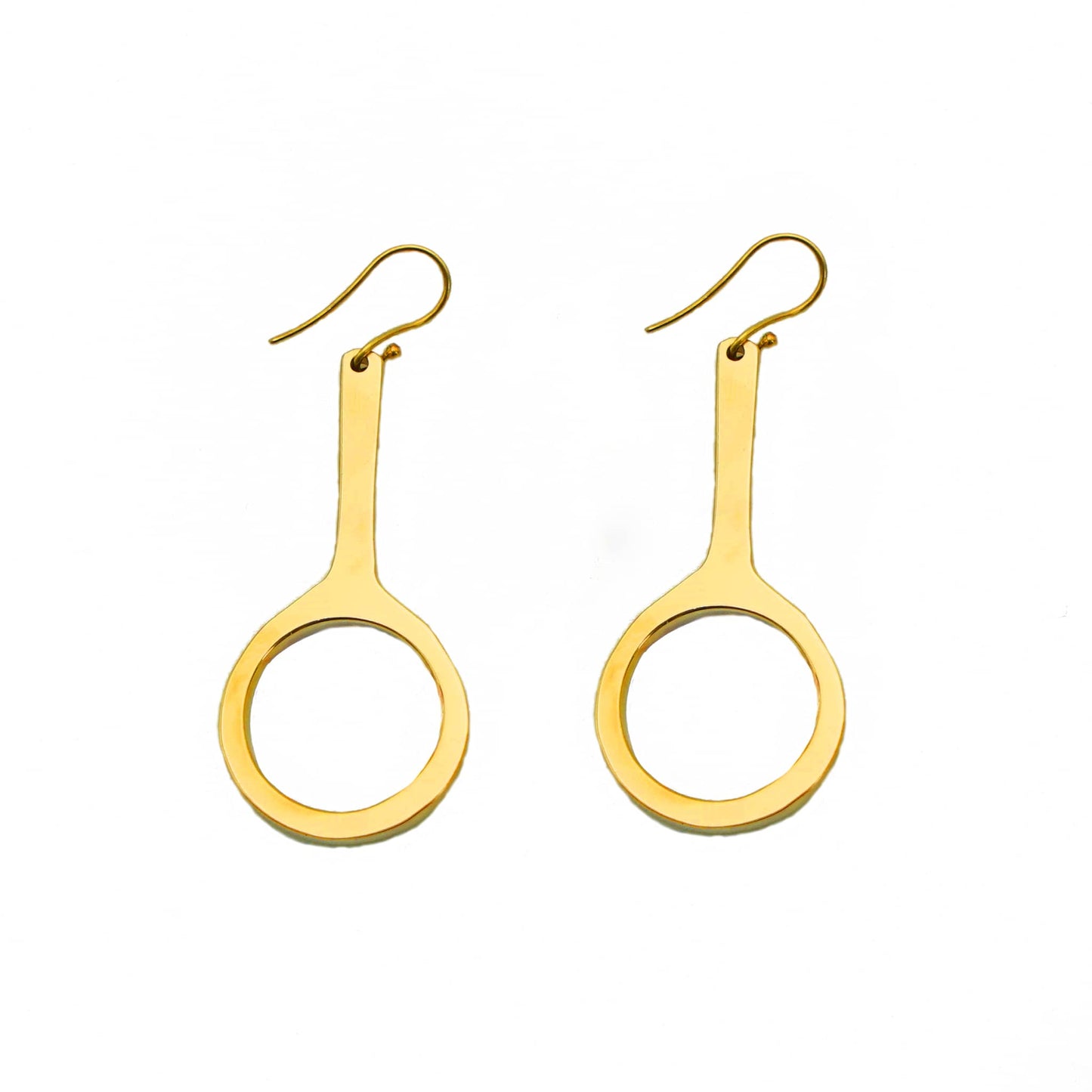 Mwenzi brass hoop with oval drop earrings flat lay — Ecodunia