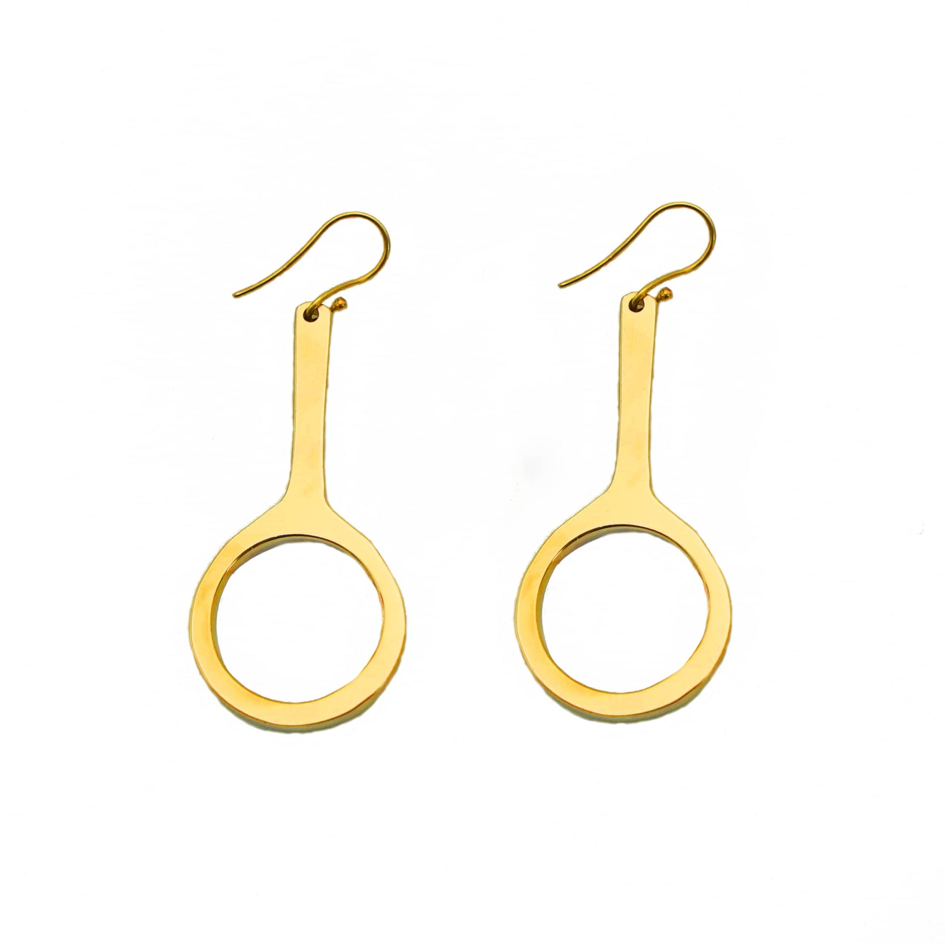 Mwenzi brass hoop with oval drop earrings flat lay — Ecodunia