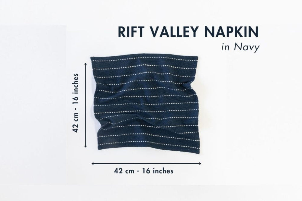 Navy rift valley napkin with white stripes and measurements on a white background