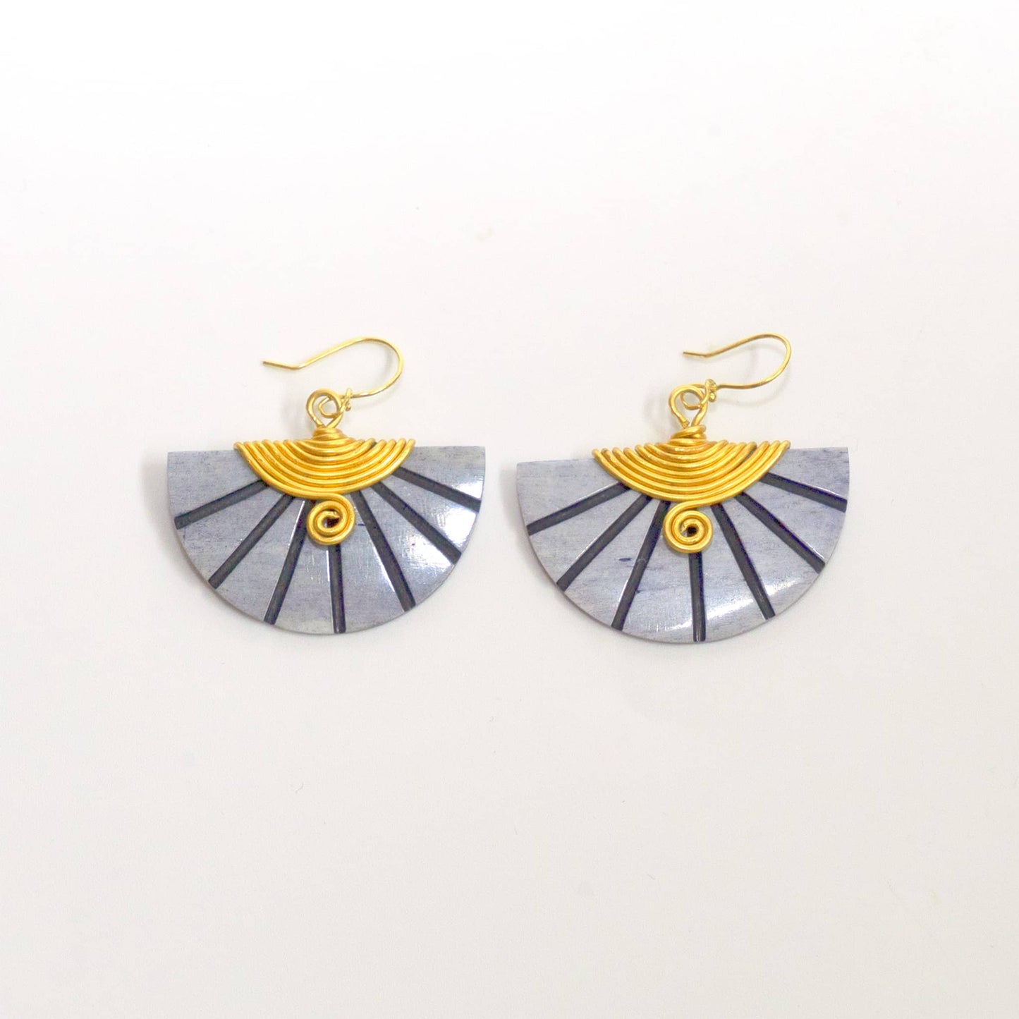 Nusu carved soapstone half-moon drop earrings flat lay — Ecodunia