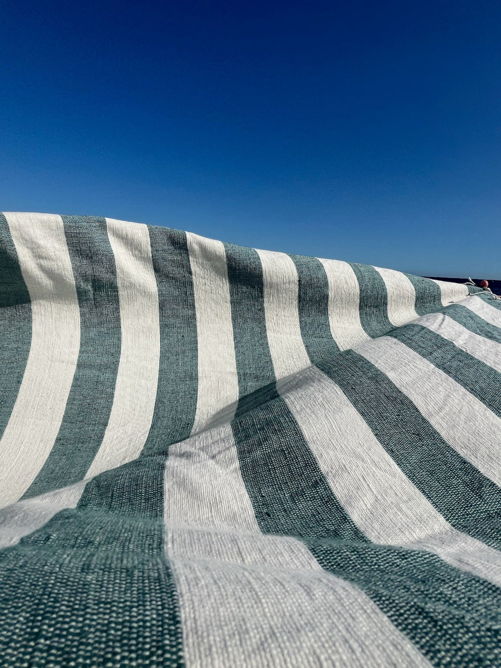 Omo towel in teal close up