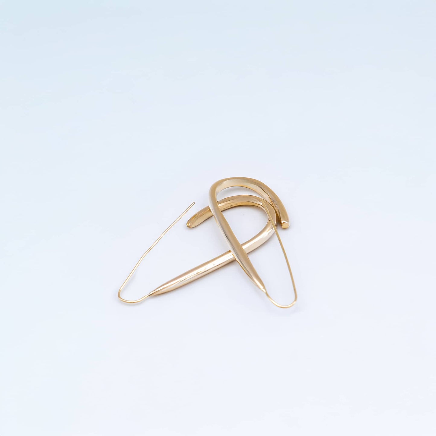 Ona U-shaped open brass hoop earrings flat lay — Ecodunia