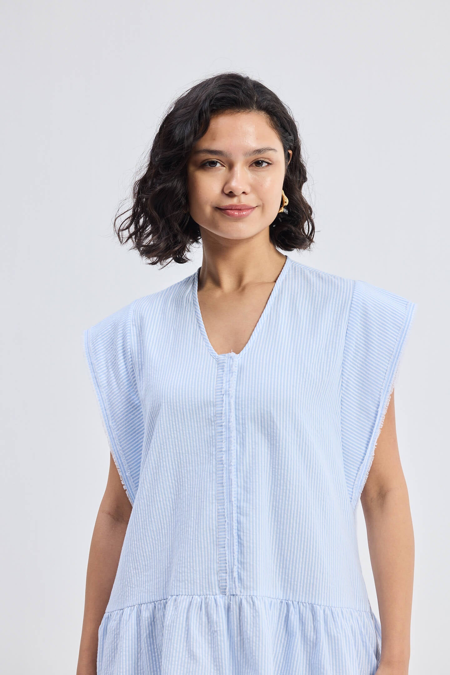 Oversized V neck Short Dress with Frayed Sleeves Closeup