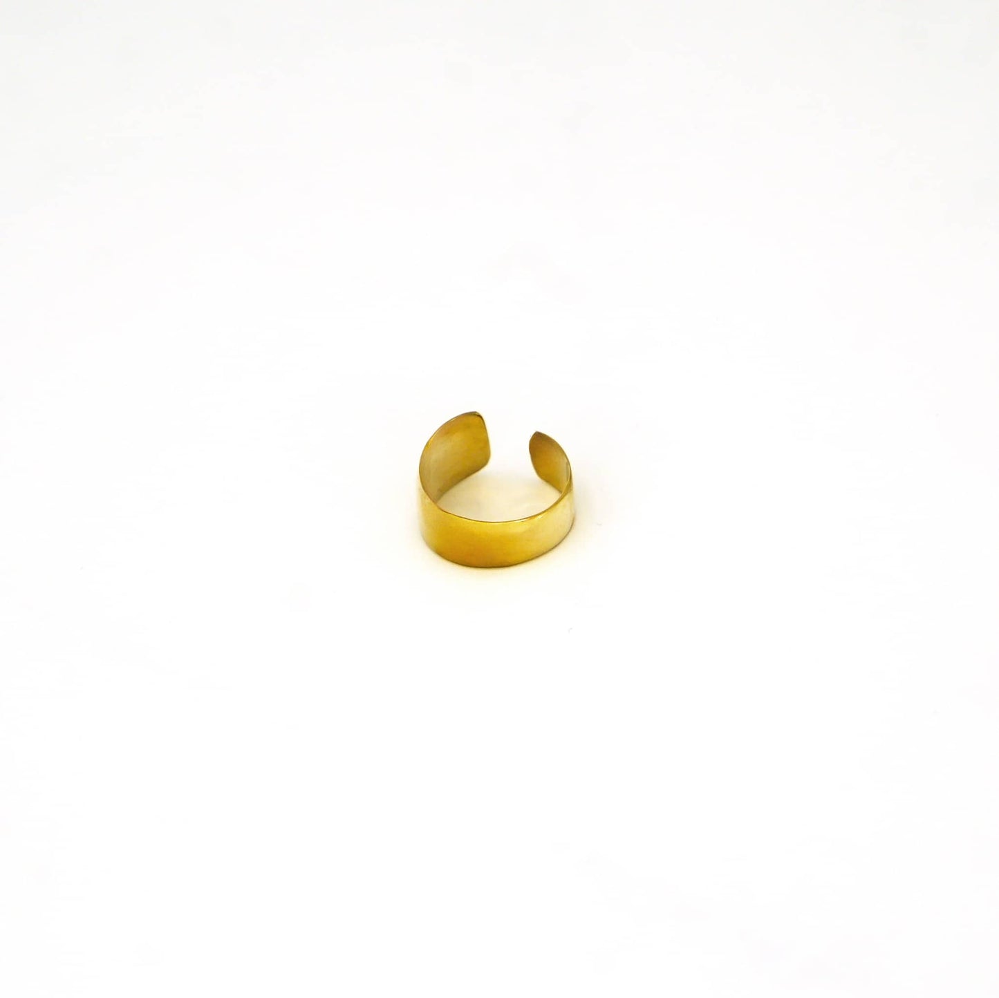 Penda adjustable wide band brass ring worn showing confident everyday fit