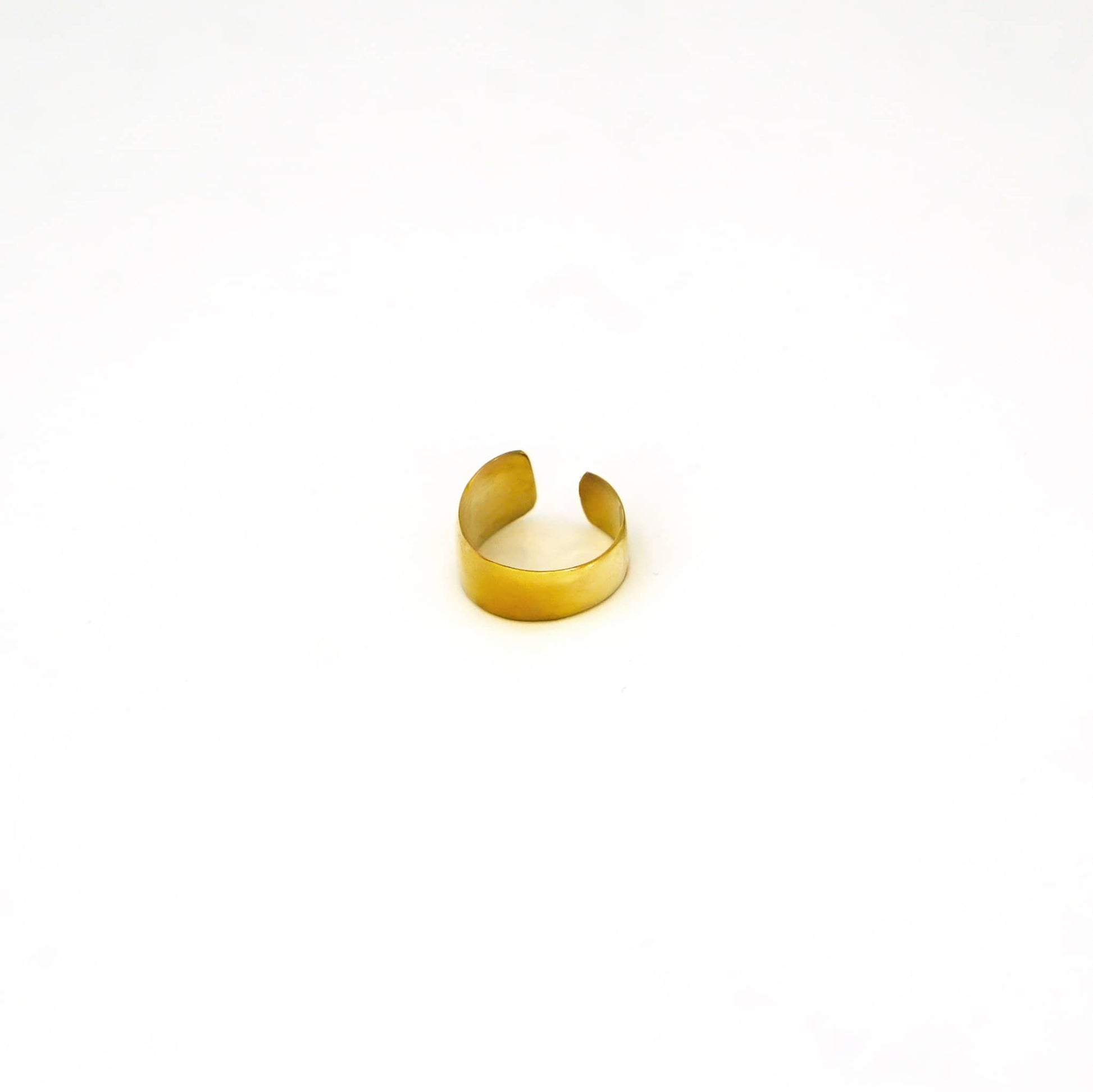 Penda adjustable wide band brass ring worn showing confident everyday fit