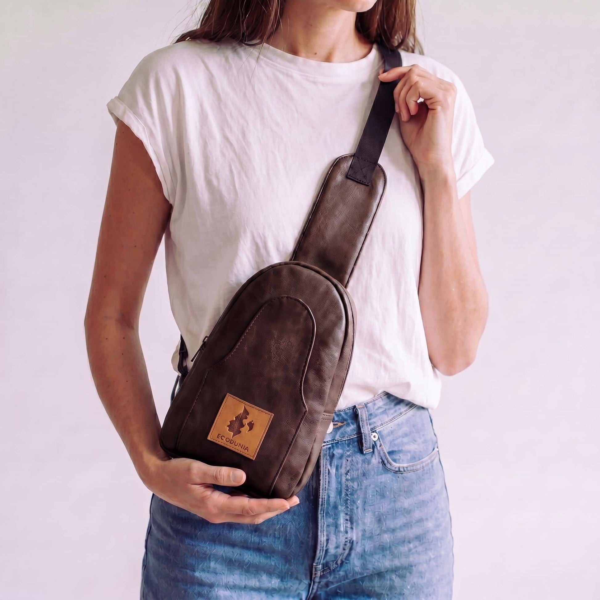 Buru plum vegan leather sling bag worn crossbody #color_plum