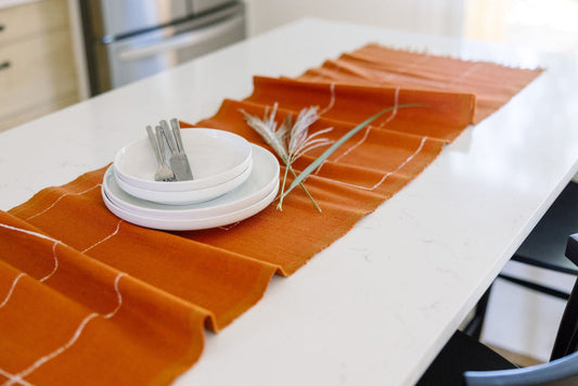 Rift Valley runner in copper on white table 