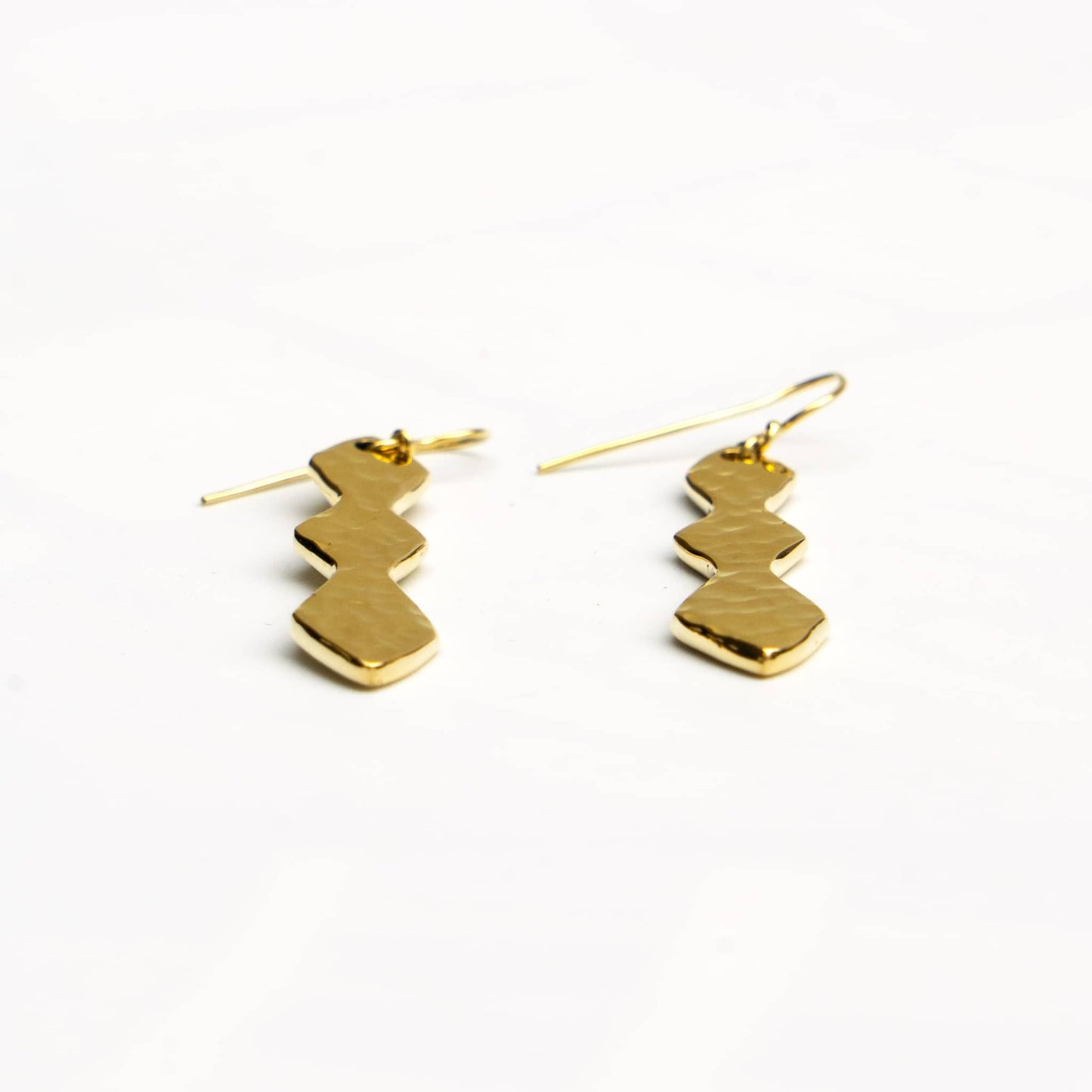 Rio brass segmented geometric drop earrings worn showing pendant