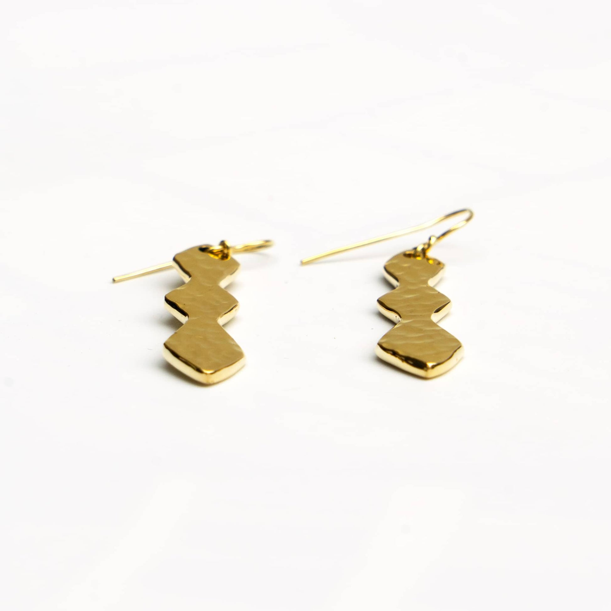Rio brass segmented geometric drop earrings worn showing pendant
