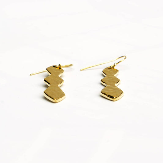 Rio brass segmented geometric drop earrings worn showing pendant