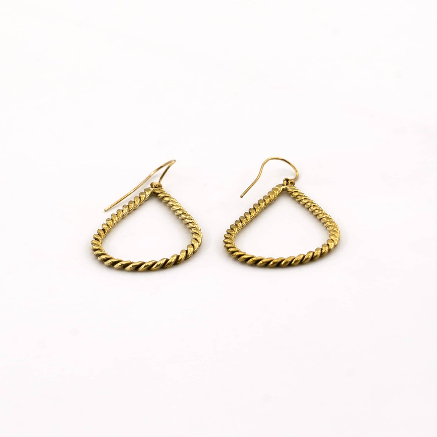 Rosa twisted brass hoop earrings flat lay — Ecodunia