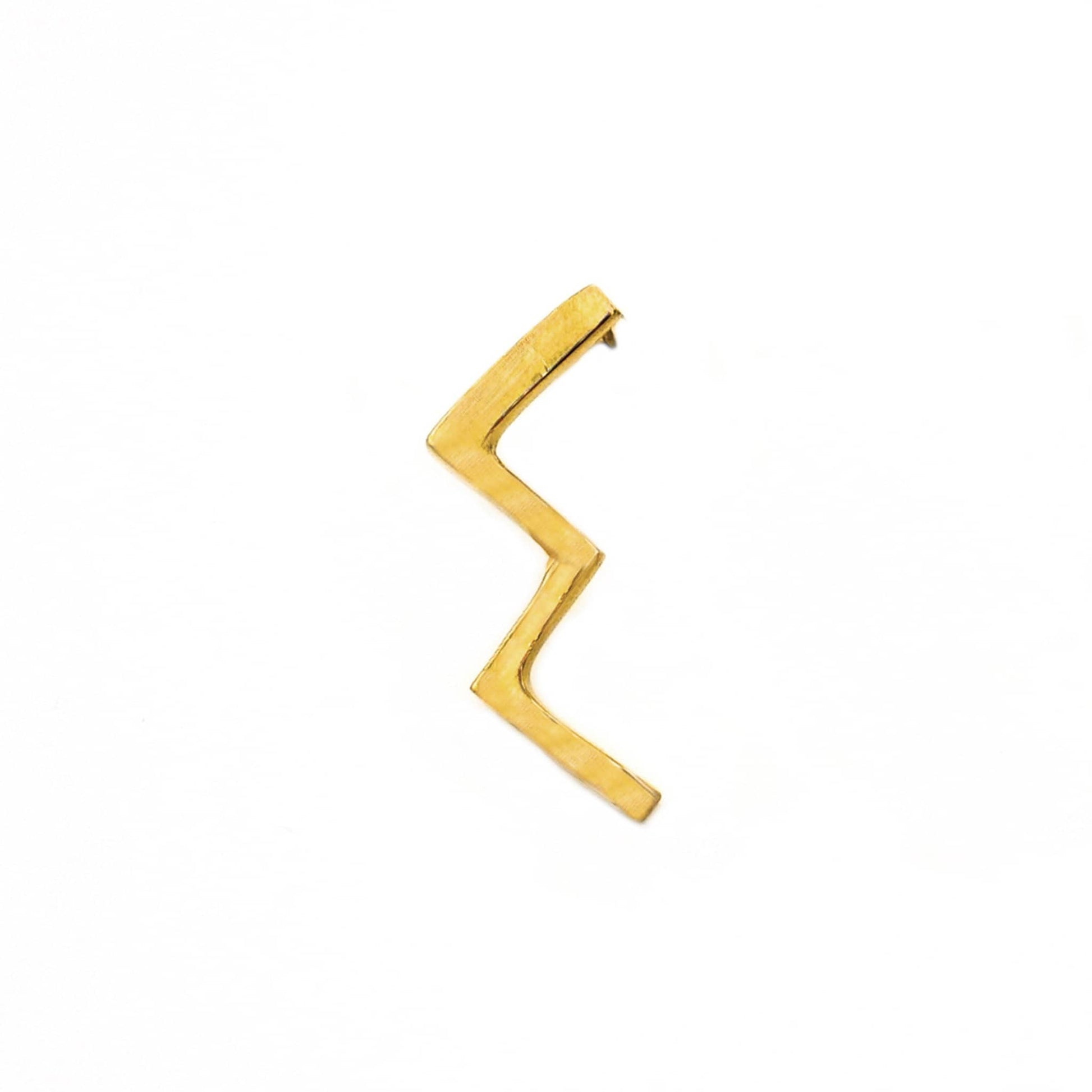 Taji brass geometric zig-zag stud earrings worn on ear