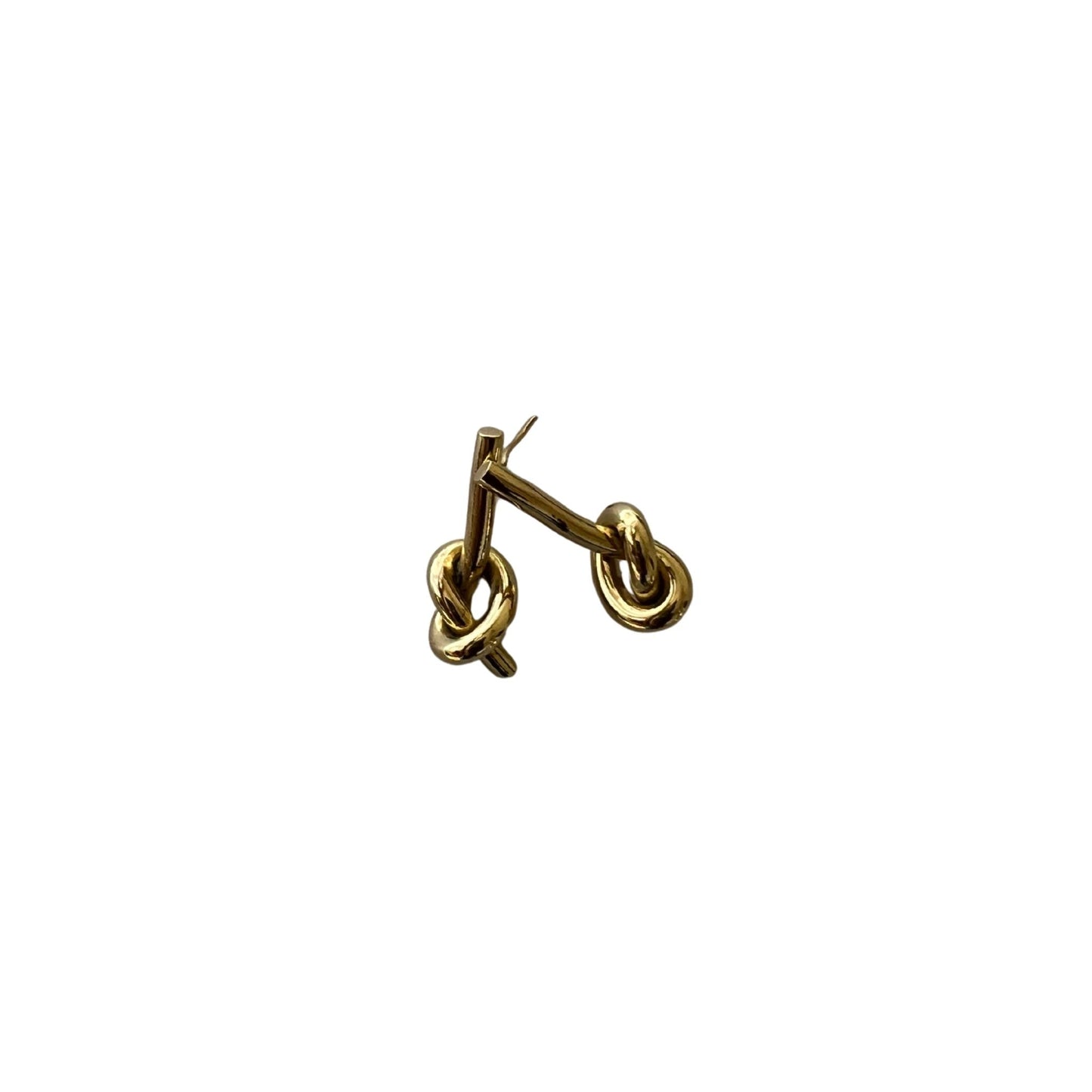 Tatu brass knot post earrings flat lay — Ecodunia