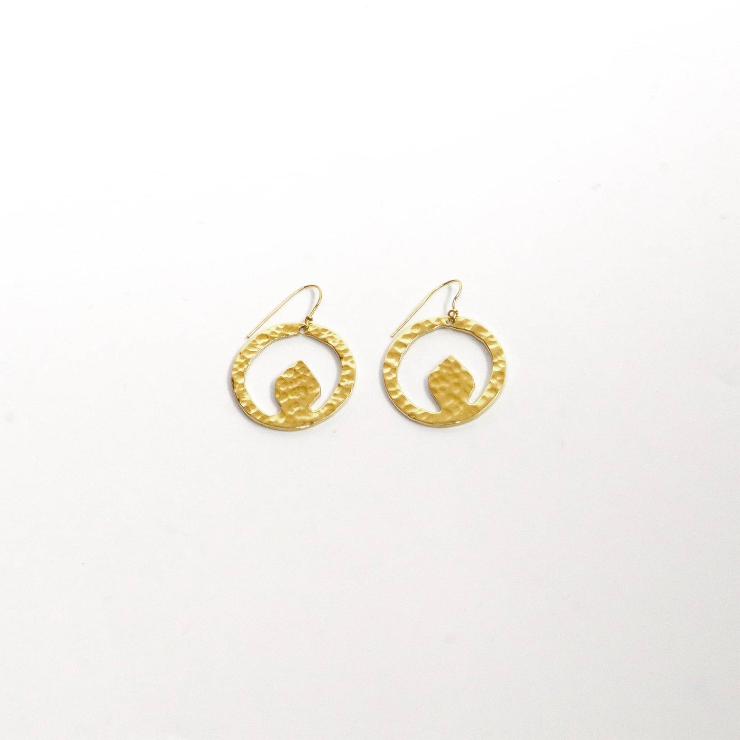 Tembo hammered brass disc earrings worn showing organic shape