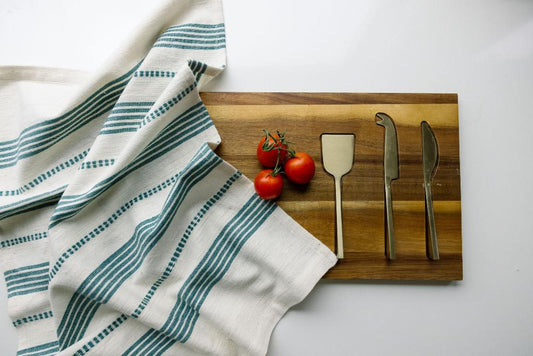 Terrara tea towel in teal with cutting board, cutlery and tomatoes