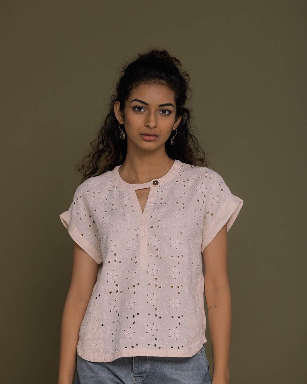 pink embroidered top with side pockets.