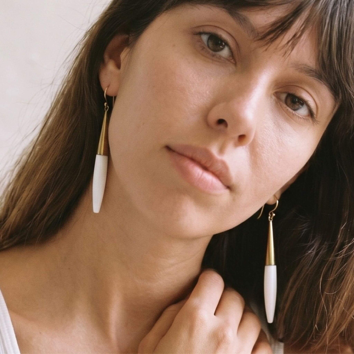 Luna brass and white horn spike drop earrings flat lay — Ecodunia #color_white