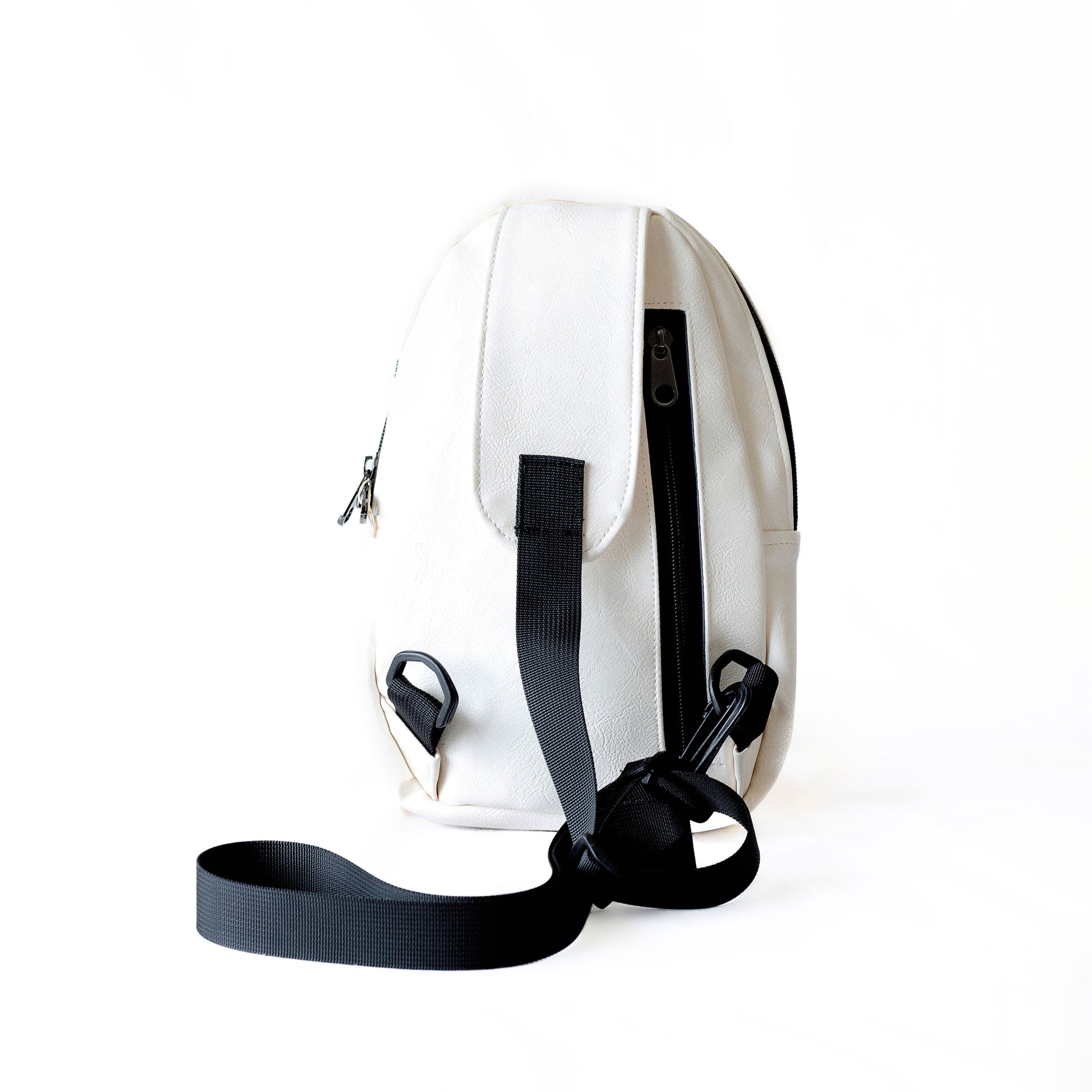 Buru white vegan leather sling bag flat lay #color_white