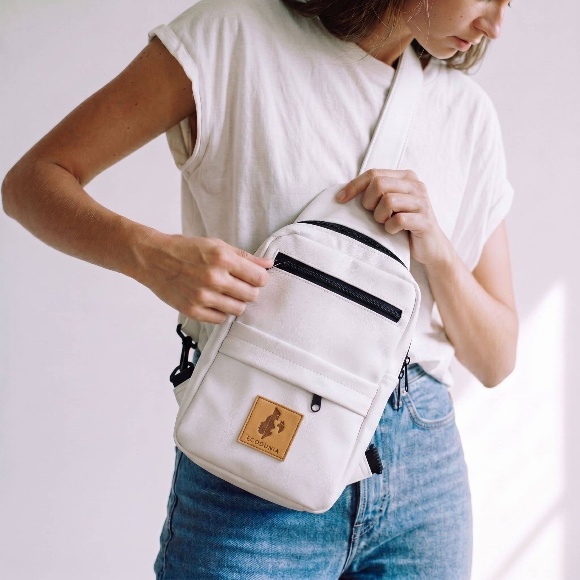 Umoja white vegan leather large sling bag travel #color_white