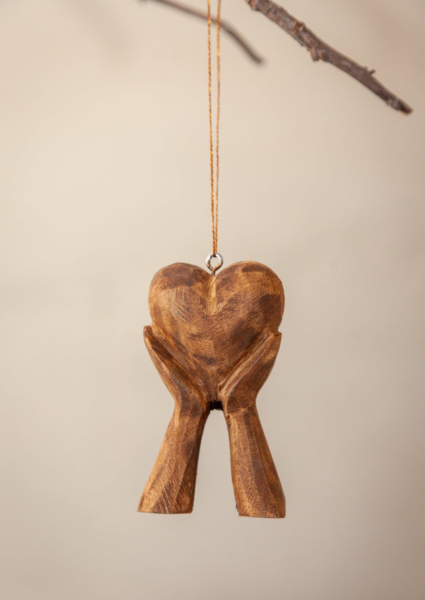 Hands Holding Heart Ornament