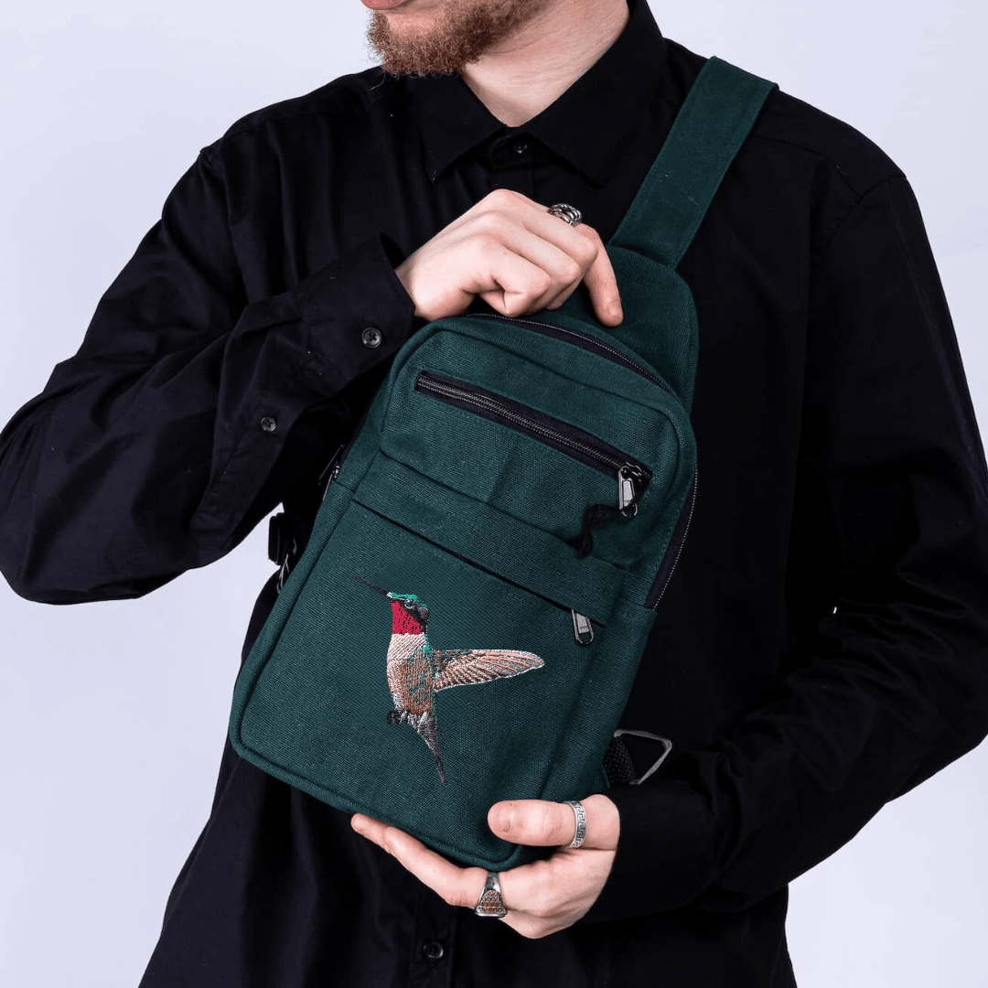 Umoja hummingbird canvas sling bag in forest green #color_forest-green