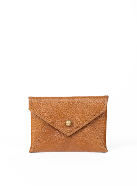 Cognac leather cardholder with a gold closure on a white background