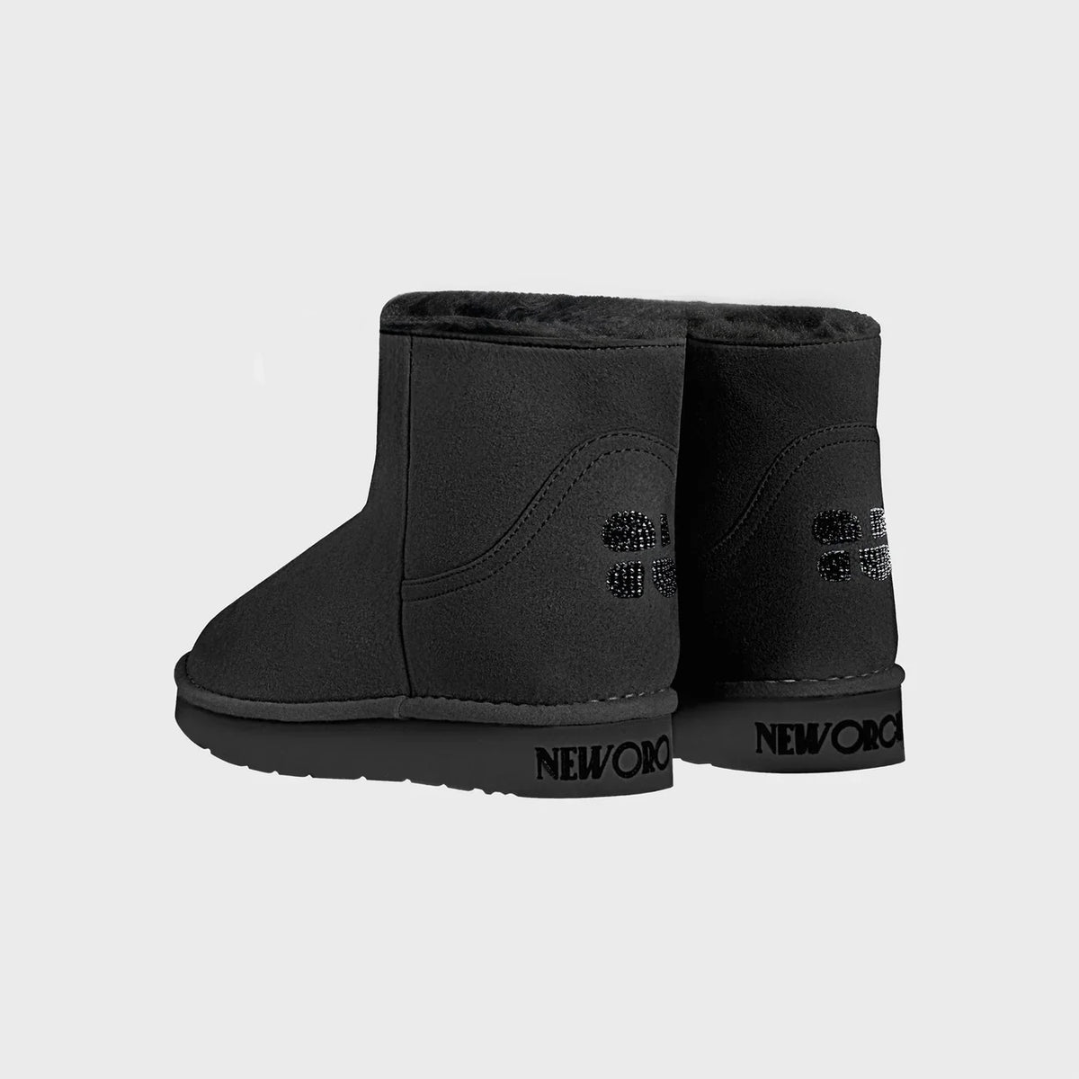 Black winter vegan boots with New Orchard logo on a light gray background