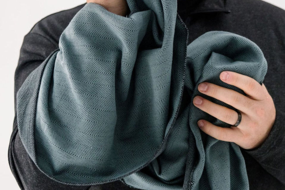 degu scarf in slate held by model
