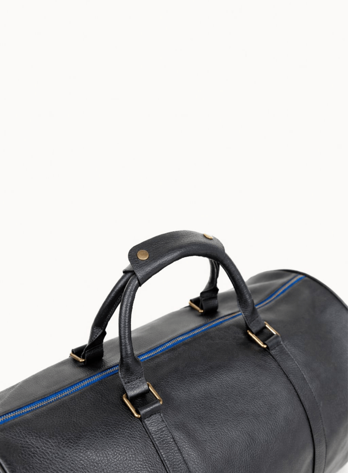 Black leather duffel bag with handles on a white background