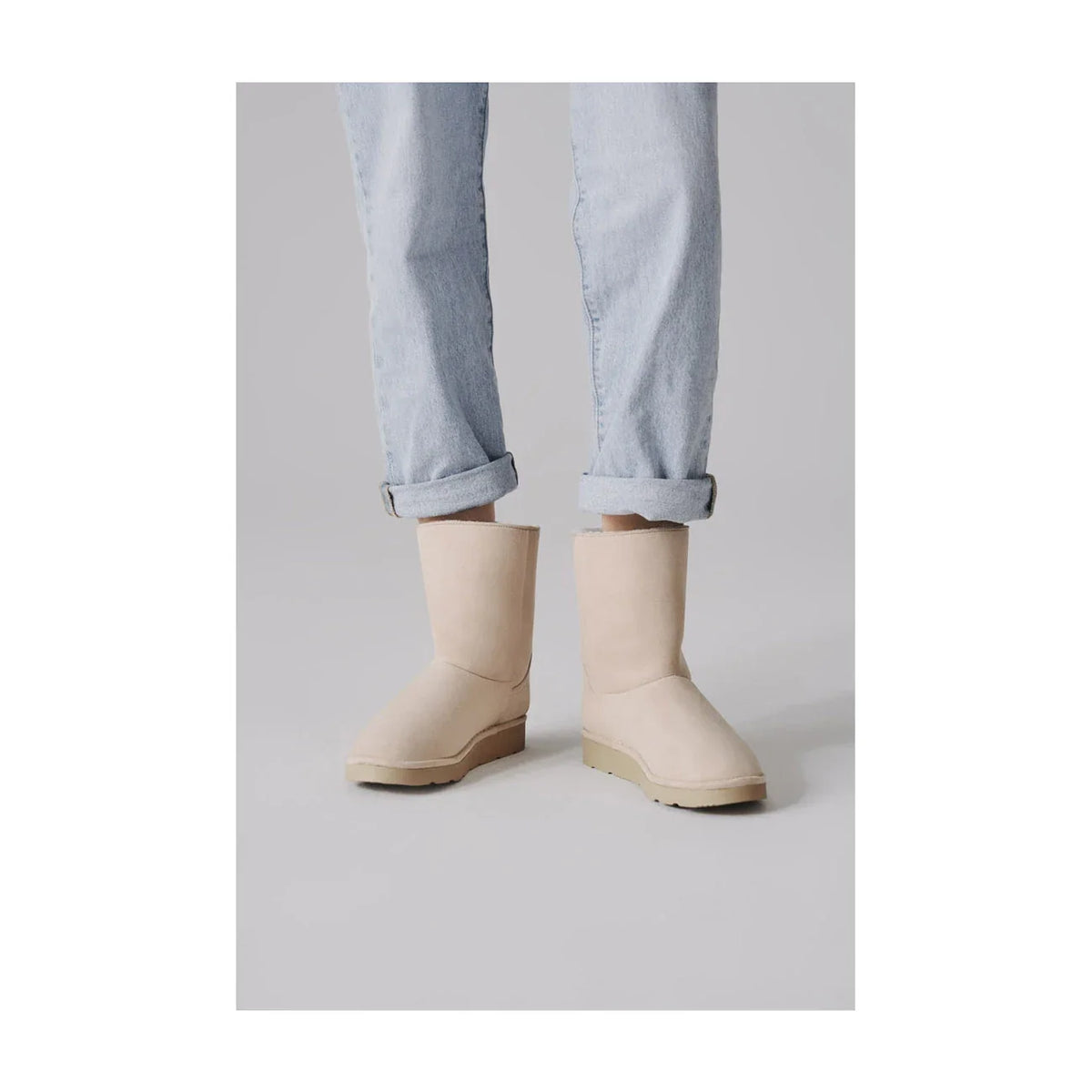 Ethical off-white mid-calf vegan boots with faux fur
