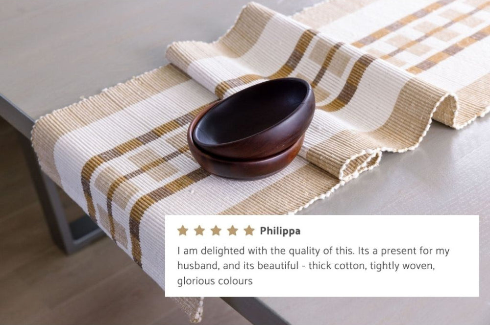 gonder table runner with wooden bowls on a table, featuring a customer review.