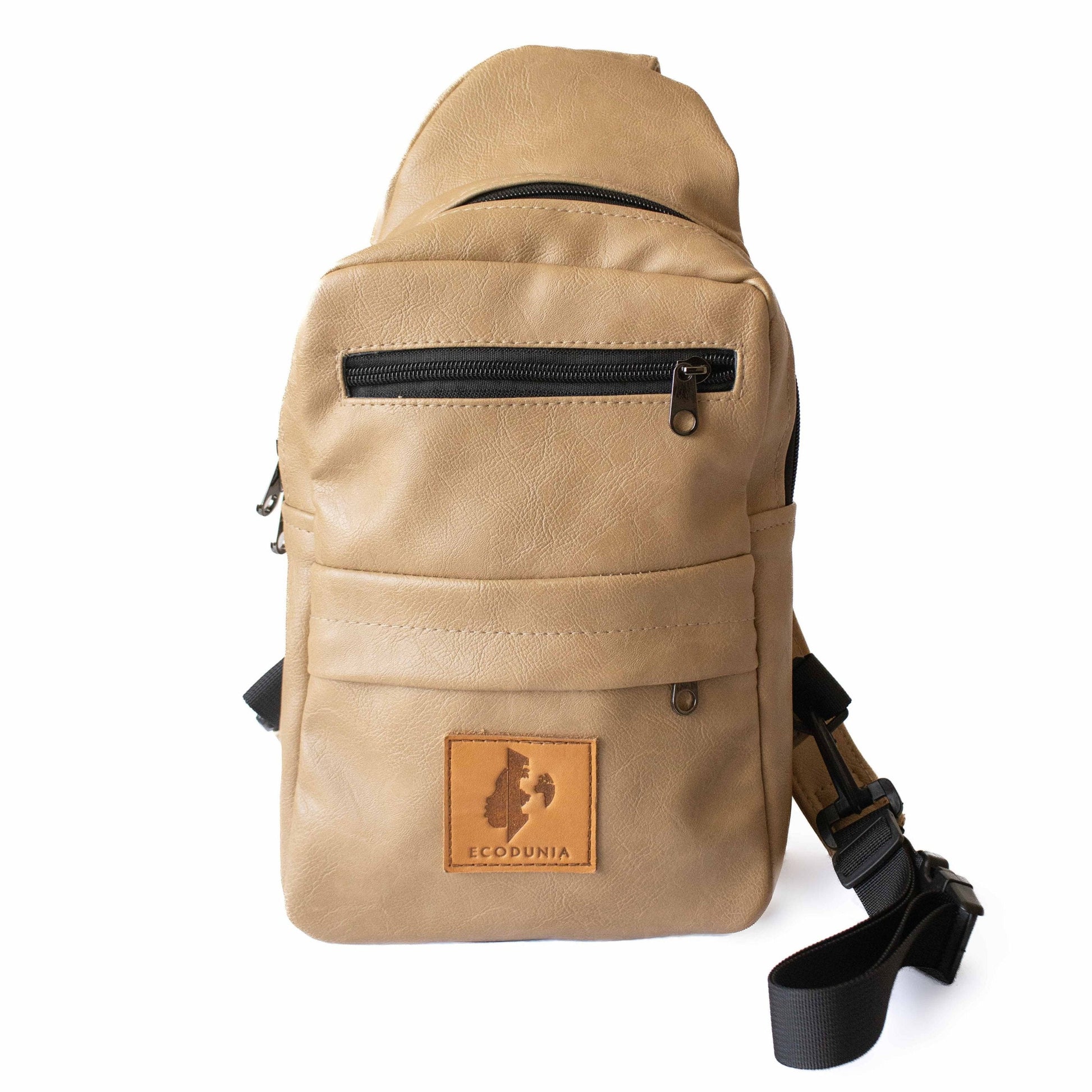 Umoja latte vegan leather sling bag flat lay #color_latte