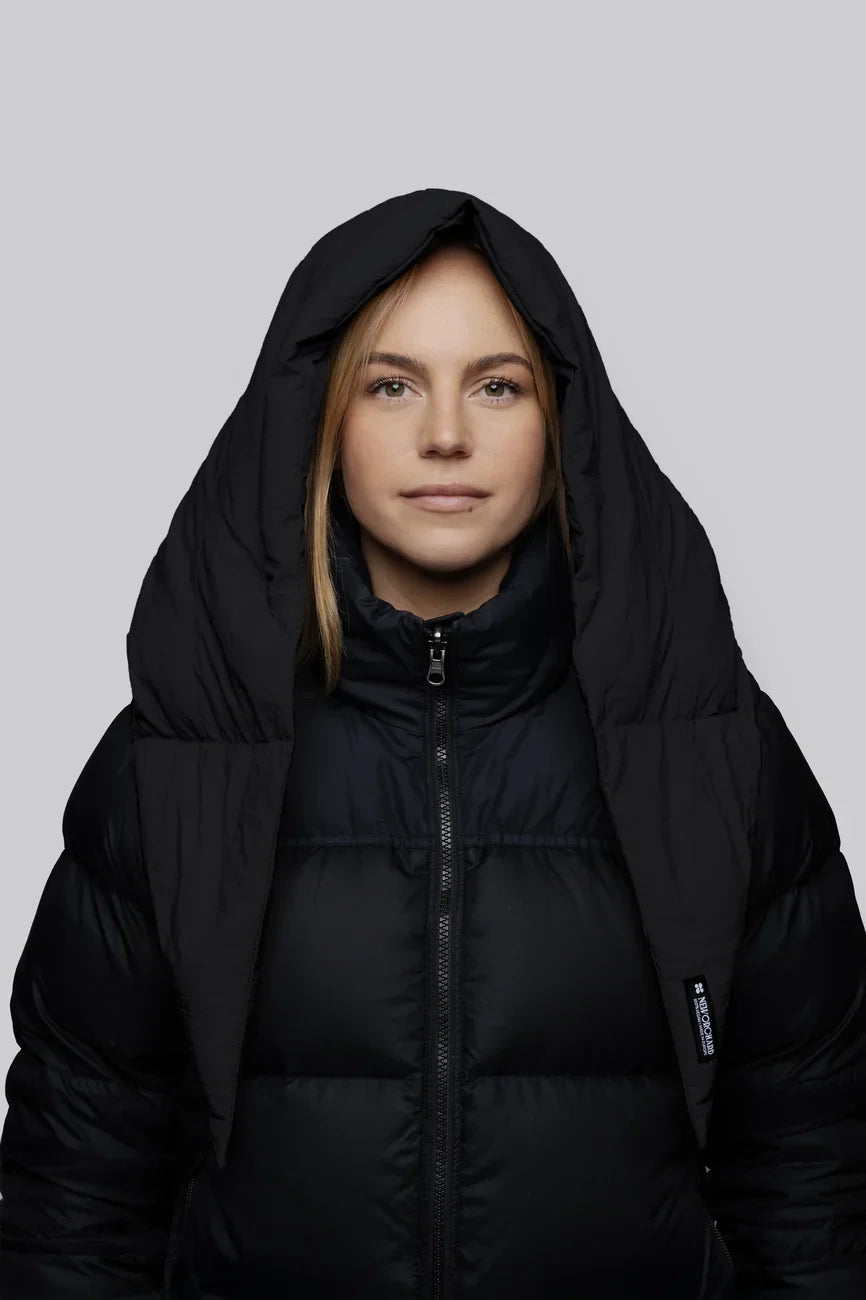 Charcoal black vegan puffer jacket with hood made from recycled materials, featuring a front zipper and sleek insulation. - The New Orchard - Charcoal Black