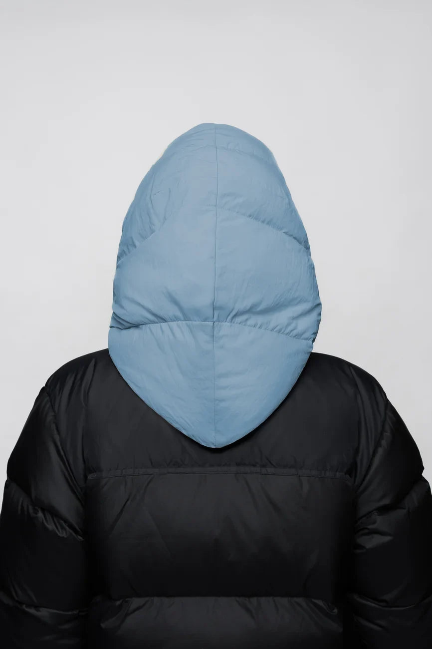 Sky blue vegan puffer capuche made from recycled materials, shown from the back. - The New Orchard - Sky Blue