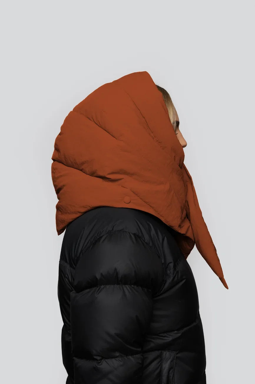 Vegan winter hood in fresh cinnamon color made from recycled materials, worn over black puffer jacket. - The New Orchard - Fresh Cinnamon