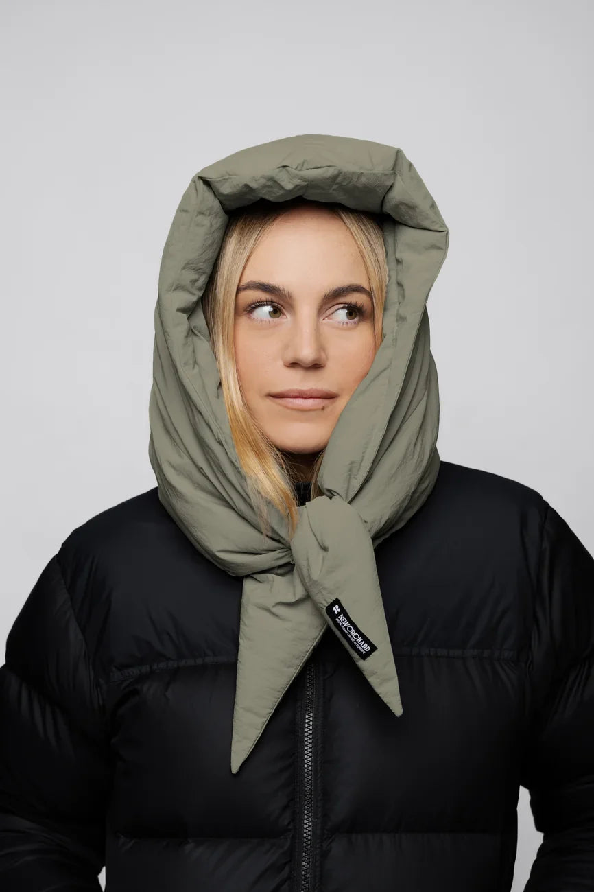 Khaki vegan winter capuche made from recycled materials, worn with black puffer jacket. - The New Orchard - Natural Khaki