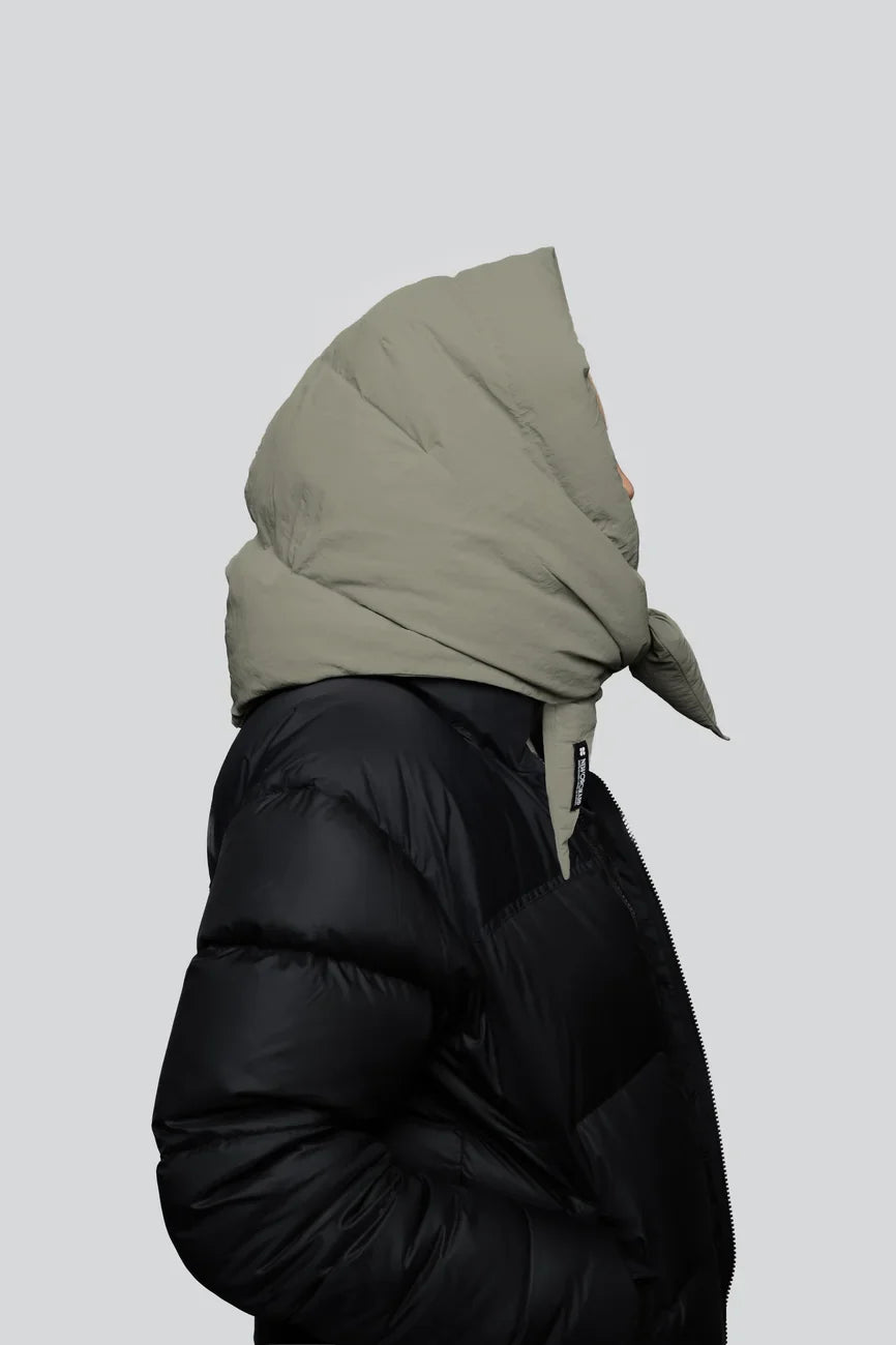 Khaki vegan winter hood with recycled materials paired with black puffer jacket side view. - The New Orchard - Natural Khaki