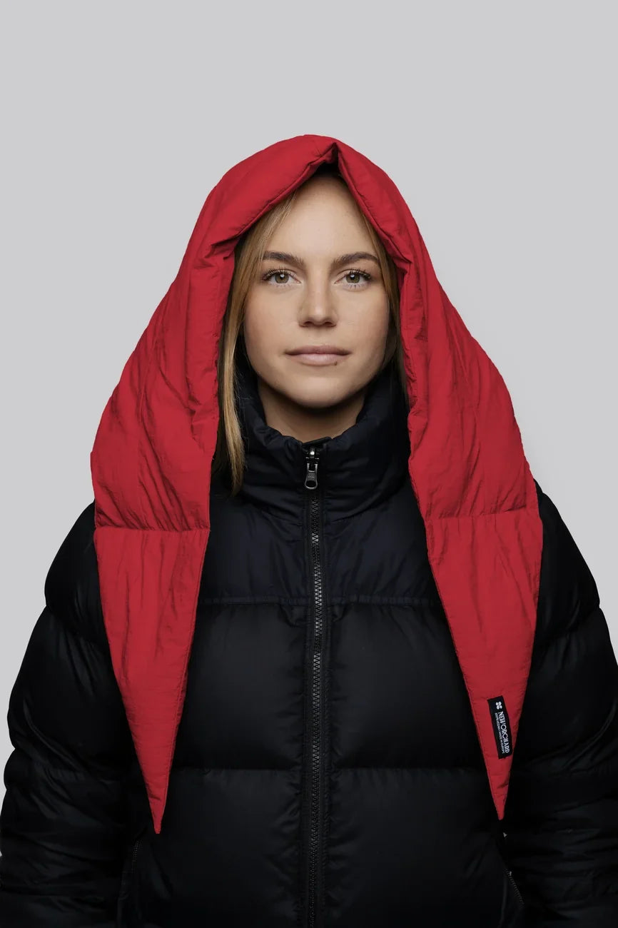 Vivid red winter vegan capuche made from recycled materials worn over black puffer jacket. - The New Orchard - Vivid Red