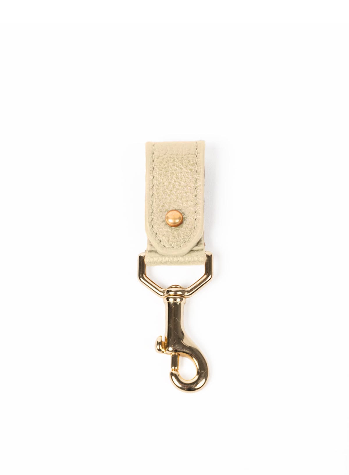 Beige key chain with gold clasp on a white background